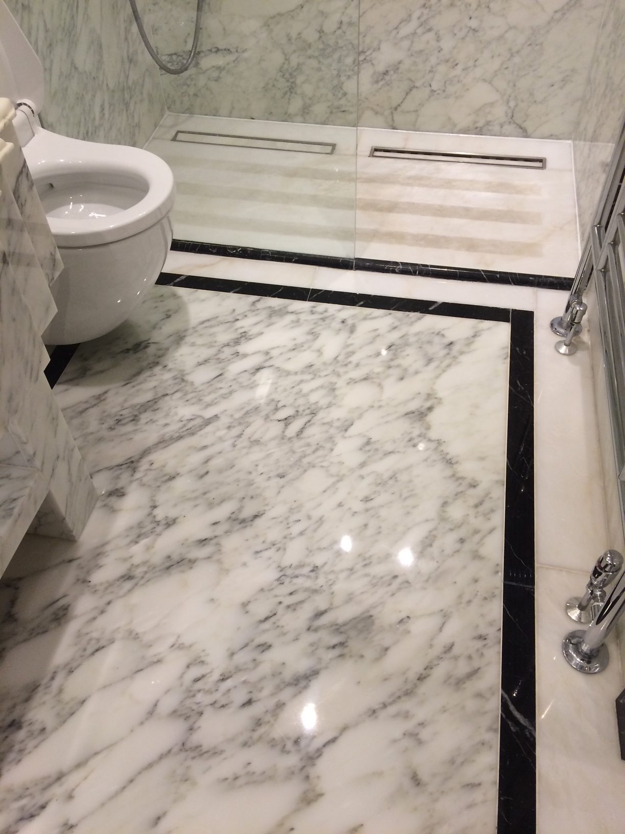 Marble bathroom floor after polishing