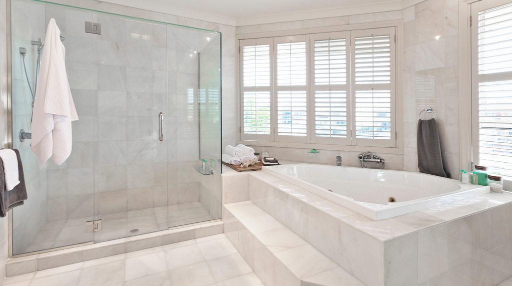 beautiful modern bathroom with marble tiles in mansion